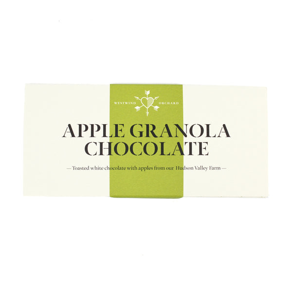 white chocolate bar wrapper with a green vertical stripe down the center. The text reads "apple granola chocolate: toasted white chocolate with apples from our hudson valley farm"