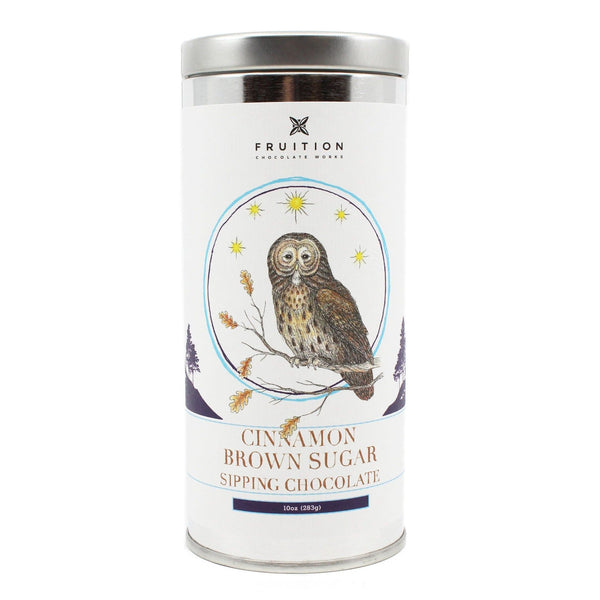 Metal tin with a white label featuring an owl sitting on a branch. Label reads "cinnamon brown sugar sipping chocolate"
