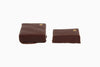 Two chocolate squares with a gold dot on the upper right corner. Black walnut and coffee flavor