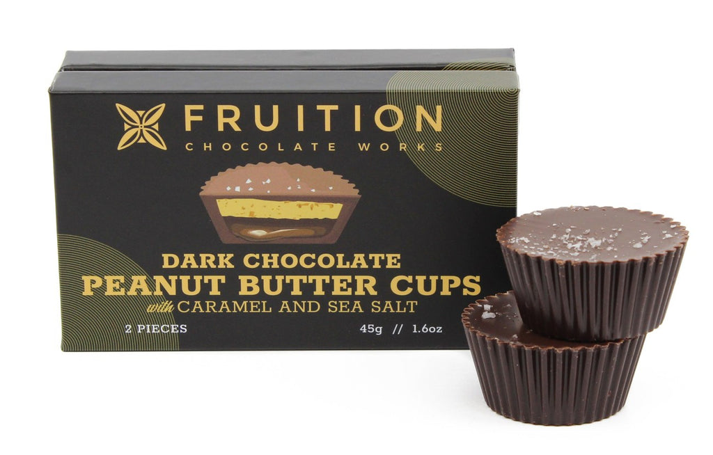 Box of Fruition Chocolate Works Dark Chocolate Peanut Butter Cups with Caramel and Sea Salt on a white background