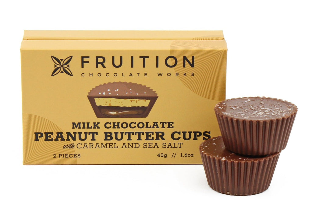 Box of Fruition Chocolate Works milk chocolate peanut butter cups with caramel and sea salt on a white background