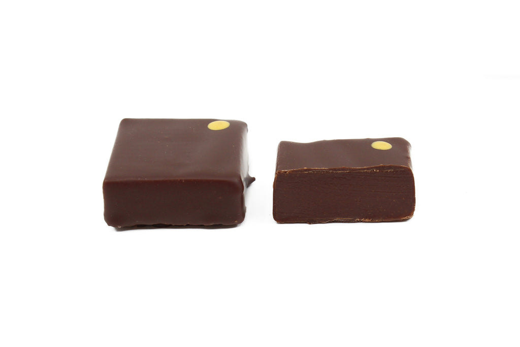 Two chocolate squares with yellow dots on the upper right corners. Tennessee honey flavor.