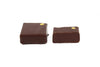 Two chocolate squares with yellow dots on the upper right corners. Tennessee honey flavor.