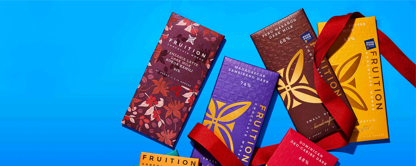 Fruition chocolate Bars against a blue background