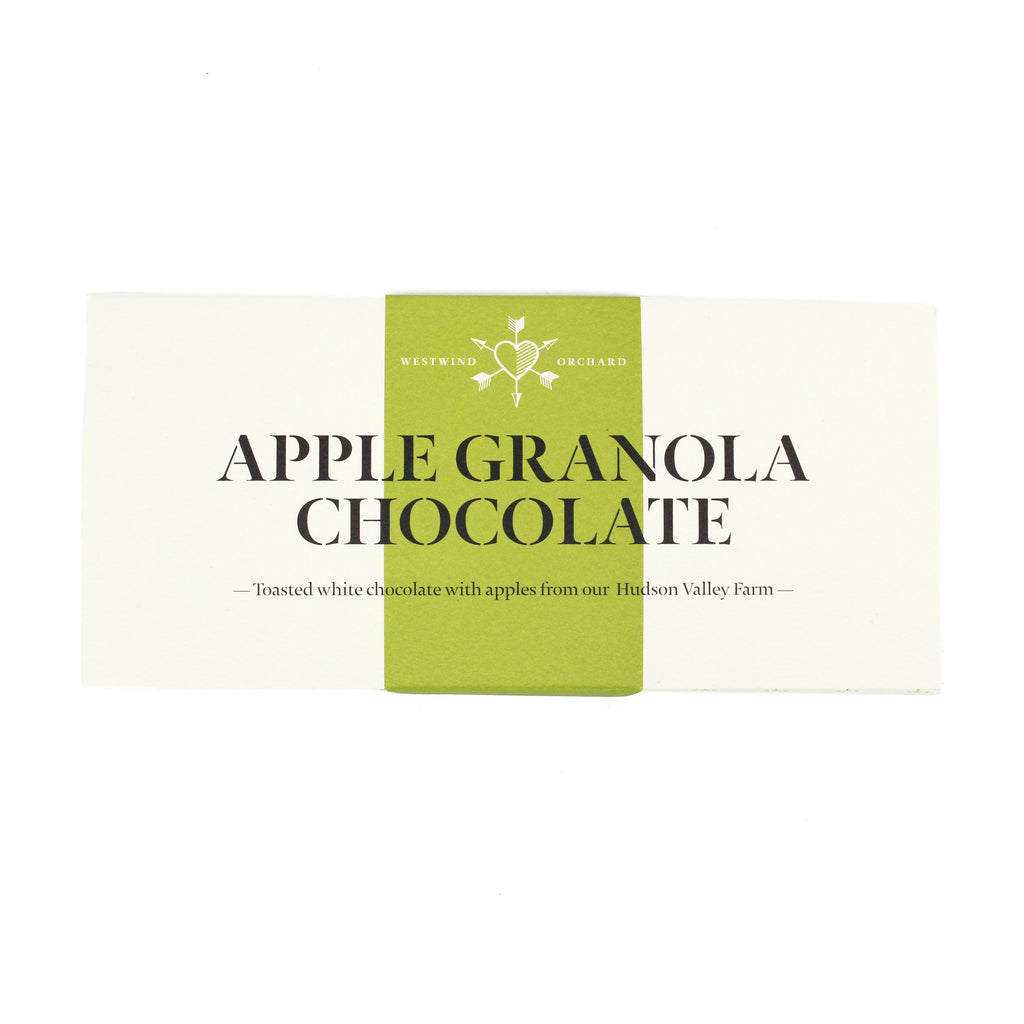 white chocolate bar wrapper with a green vertical stripe down the center. The text reads "apple granola chocolate: toasted white chocolate with apples from our hudson valley farm"