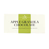 white chocolate bar wrapper with a green vertical stripe down the center. The text reads "apple granola chocolate: toasted white chocolate with apples from our hudson valley farm"