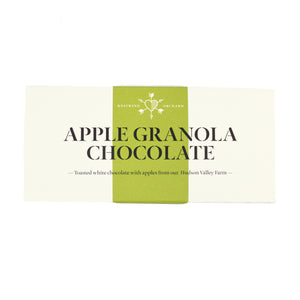 white chocolate bar wrapper with a green vertical stripe down the center. The text reads "apple granola chocolate: toasted white chocolate with apples from our hudson valley farm"