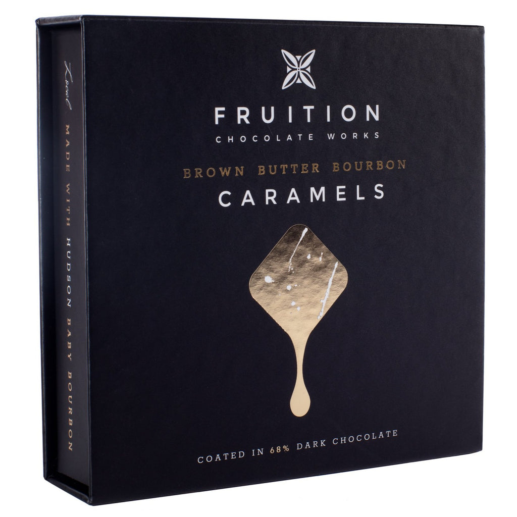 black box with a dripping gold square on the front. The box reads "fruition chocolate works, brown butter bourbon caramels"